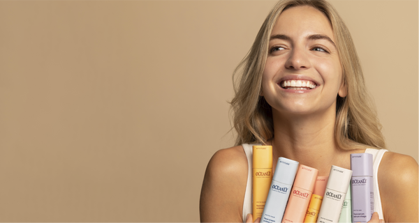 woman hanging all the skincare plastic free products from ATTITUDE